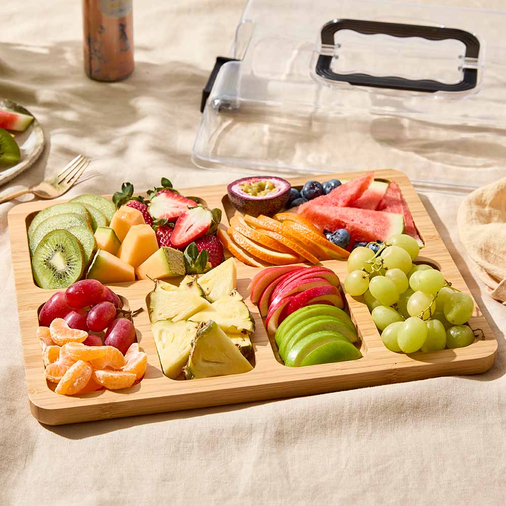 Divided Travel grazing board with lid filled with fruit