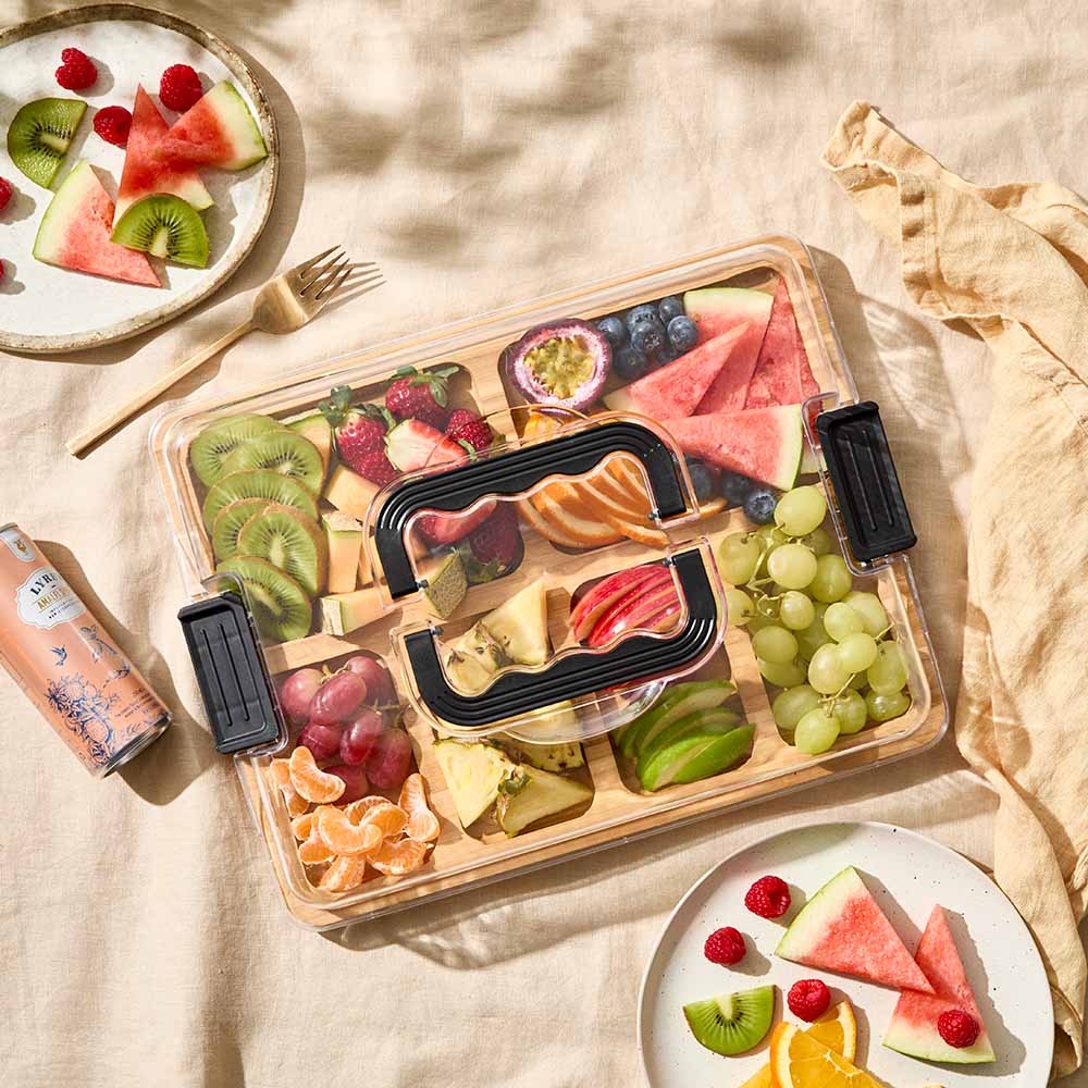 Divided Travel grazing board with lid filled with fruit