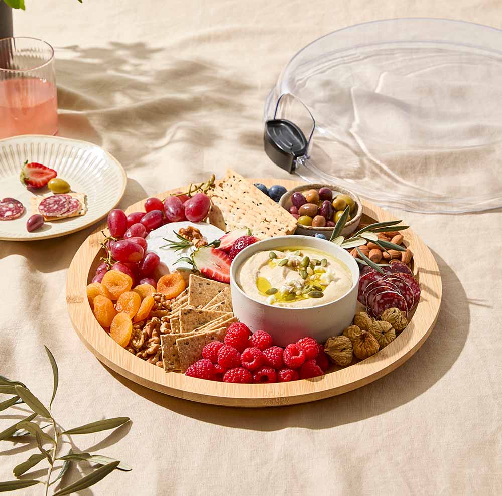 Round Grazing Travel Board with lid fill with charcuterie