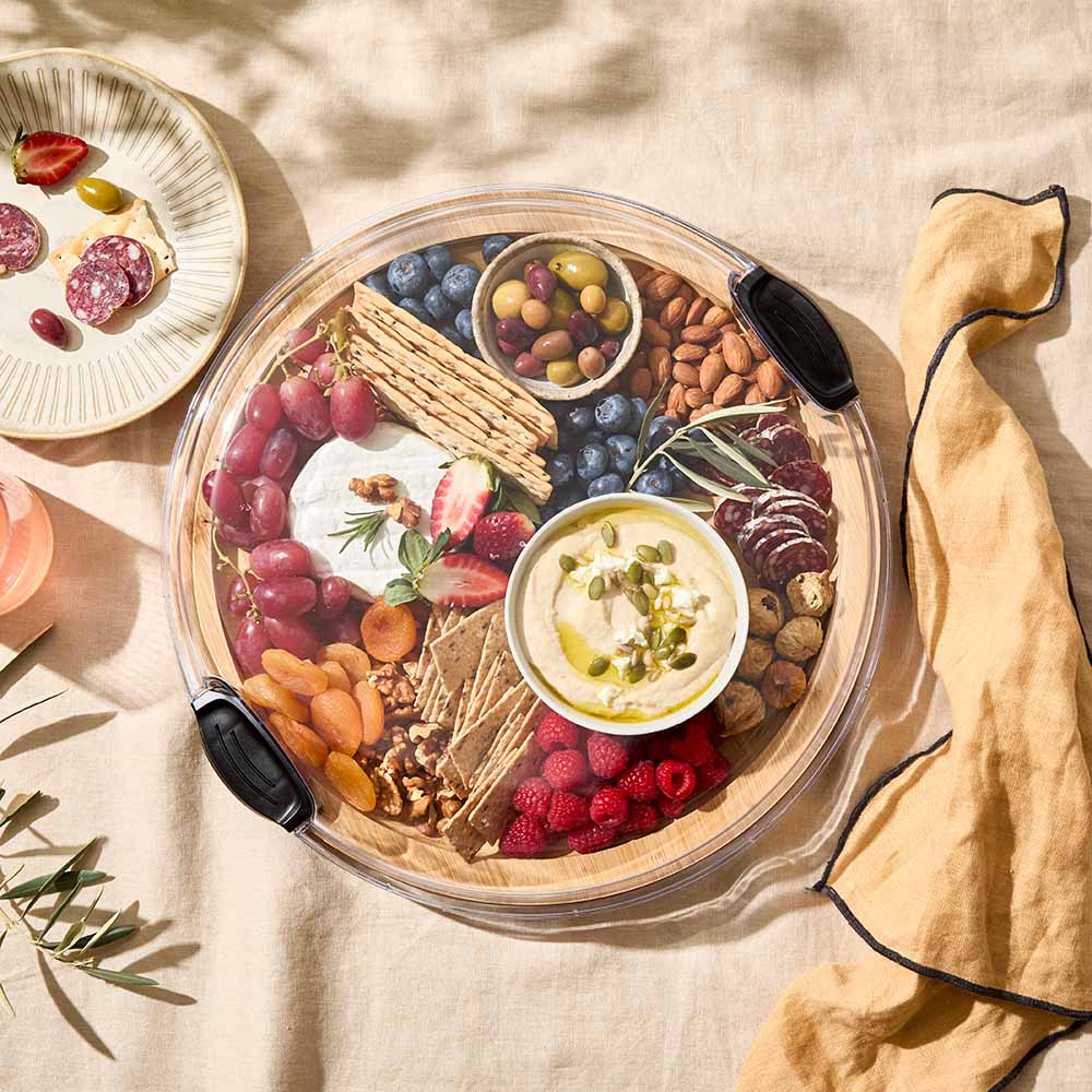 Round Grazing Travel Board with lid fill with charcuterie