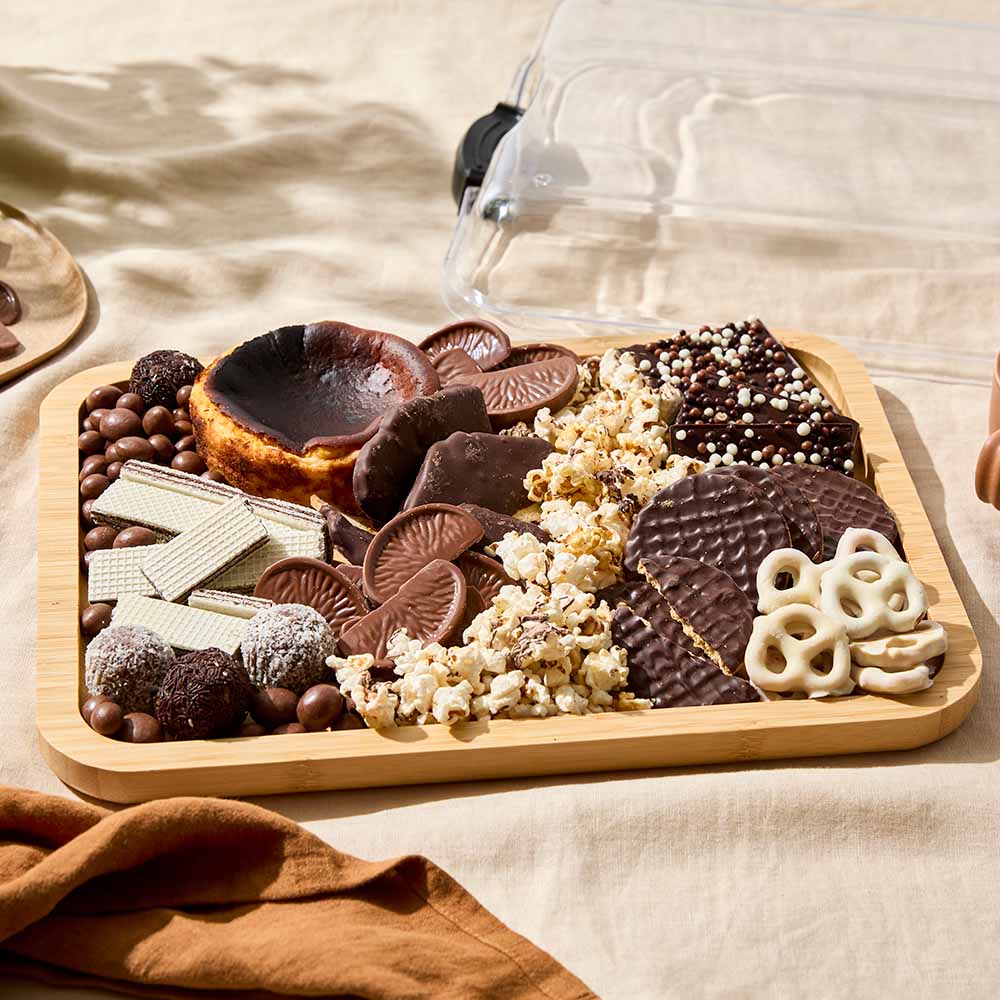 Rectangular Grazing Travel Board with lid filled with chocolate sweets