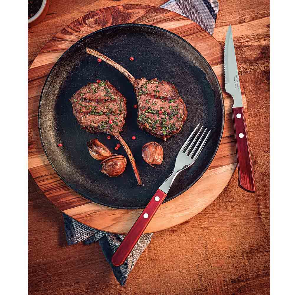 steak knife set with plate of cutlets on wooden table - Robins Kitchen