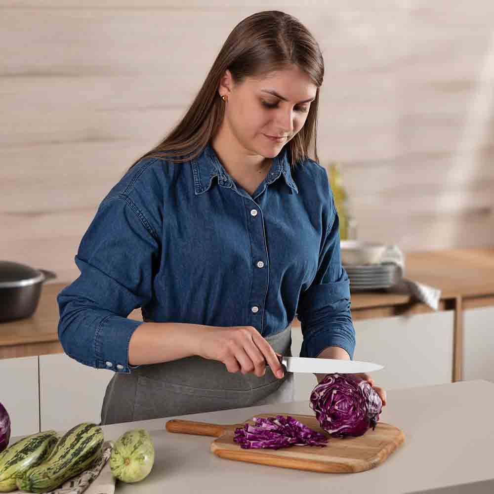 woman chopping cabbage with Utility Knife - Robins Kitchen