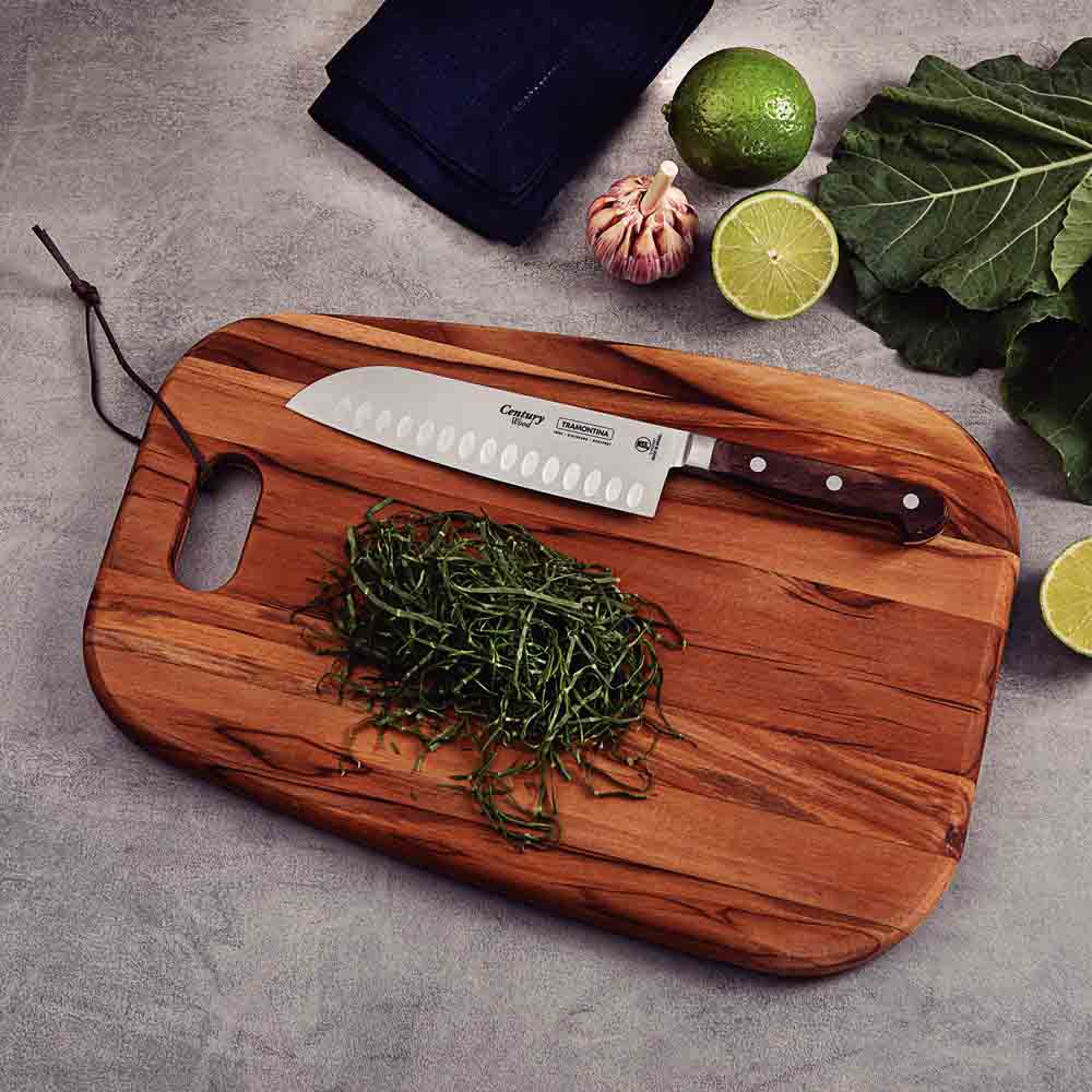 Santoku Knifeon wooden board with sliced vegetables- Robins Kitchen