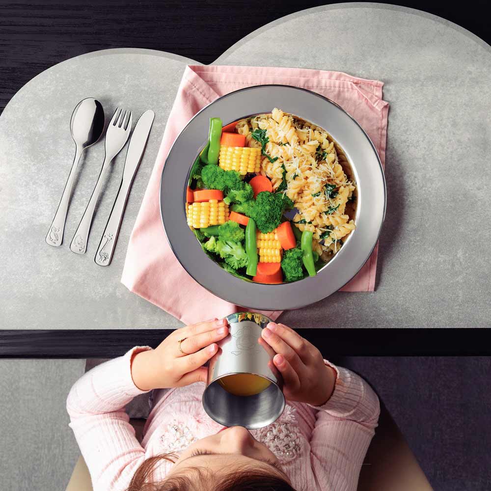 Girl sitting at table with dinner and cutlery - Robins Kitchen
